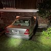 BC man loses control while ‘doing donuts,’ lodges vehicle into house